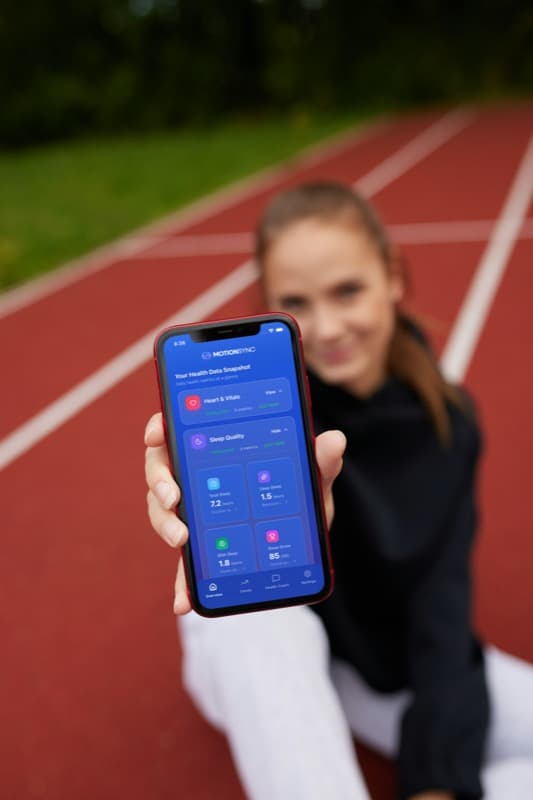 Woman viewing her health snapshot on MotionSync app
